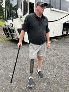 David King standing in front of his luxury tour bus. 