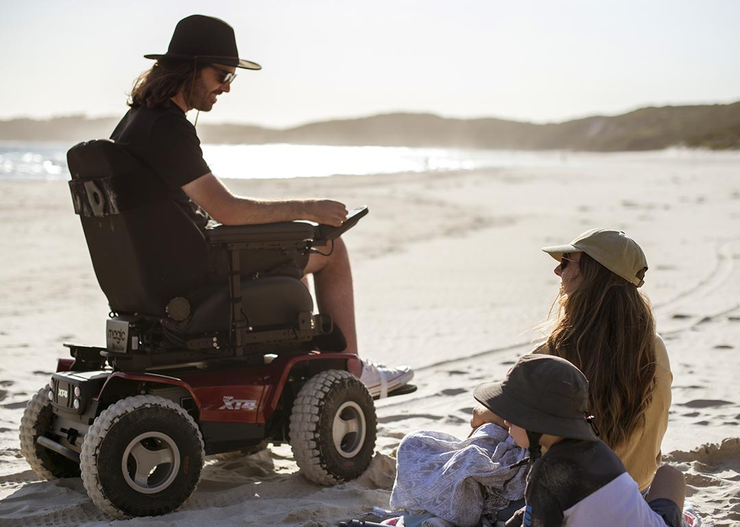 Family time on the beach in the Magic Mobility XT4