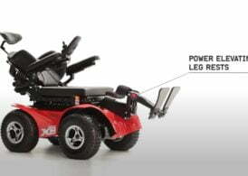 Centre Mounted Power Elevated legrests on an Magic Mobility Extreme X8 wheelchair