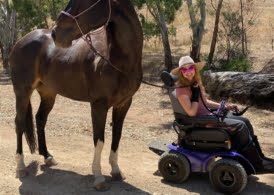 Leonie in her Extreme X8 walking her horse