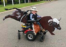 Beau enjoying Halloween in his Magic Mobility powerchair