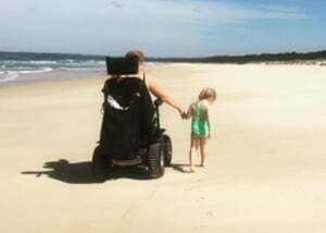 Nicky Gooze enjoys the beach thanks to her Magic Mobility powerchair