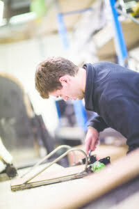 One of our engineers working on Magic Mobility seat.