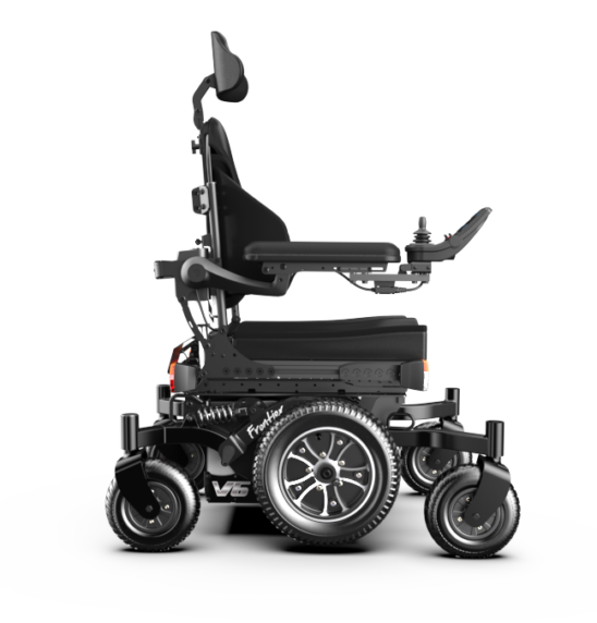 Black powered wheelchair with joystick control, headrest, and large rear wheels visible from the side.