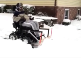 powering through snow in powerchair